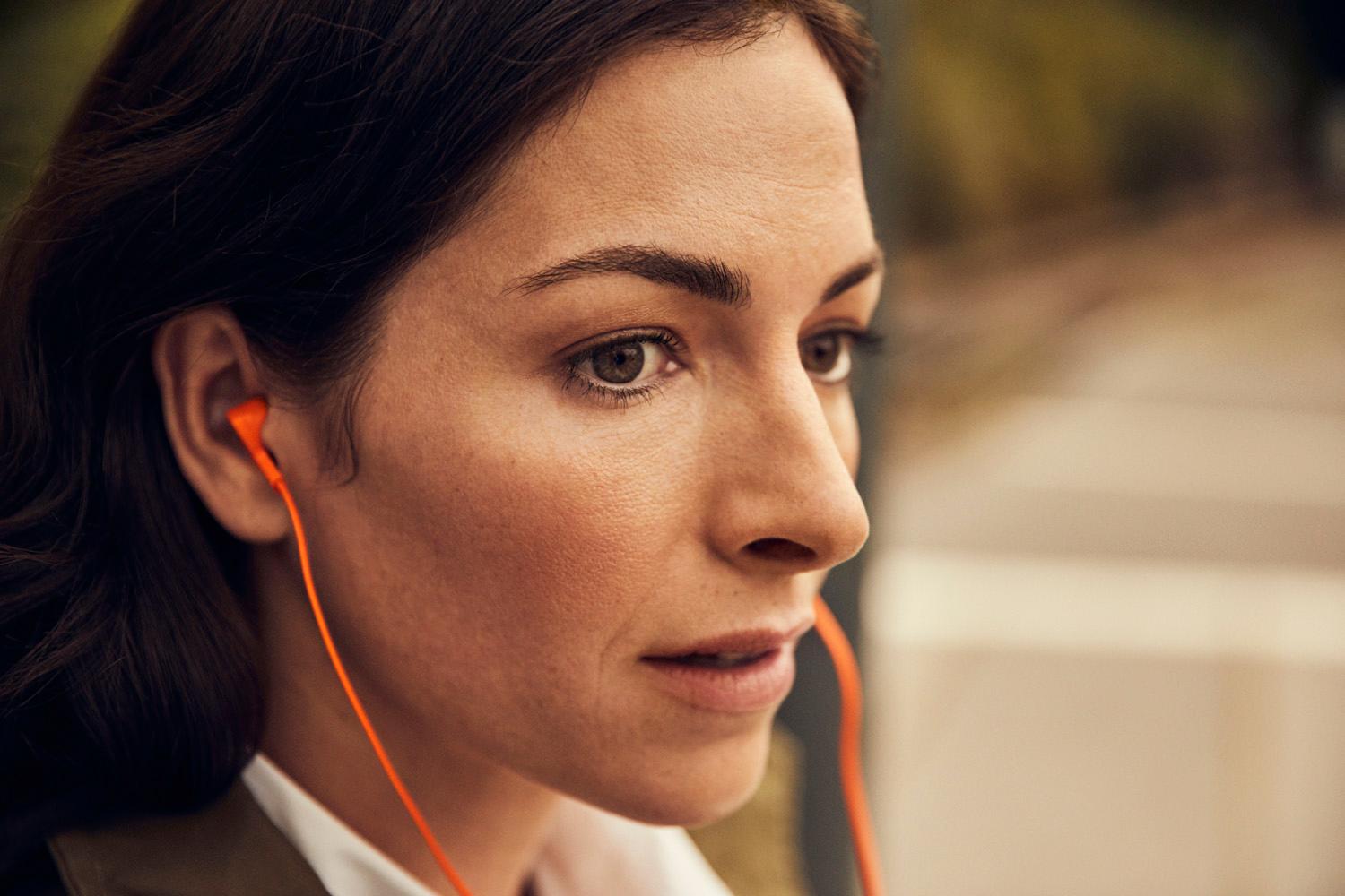 A woman listening to a book.