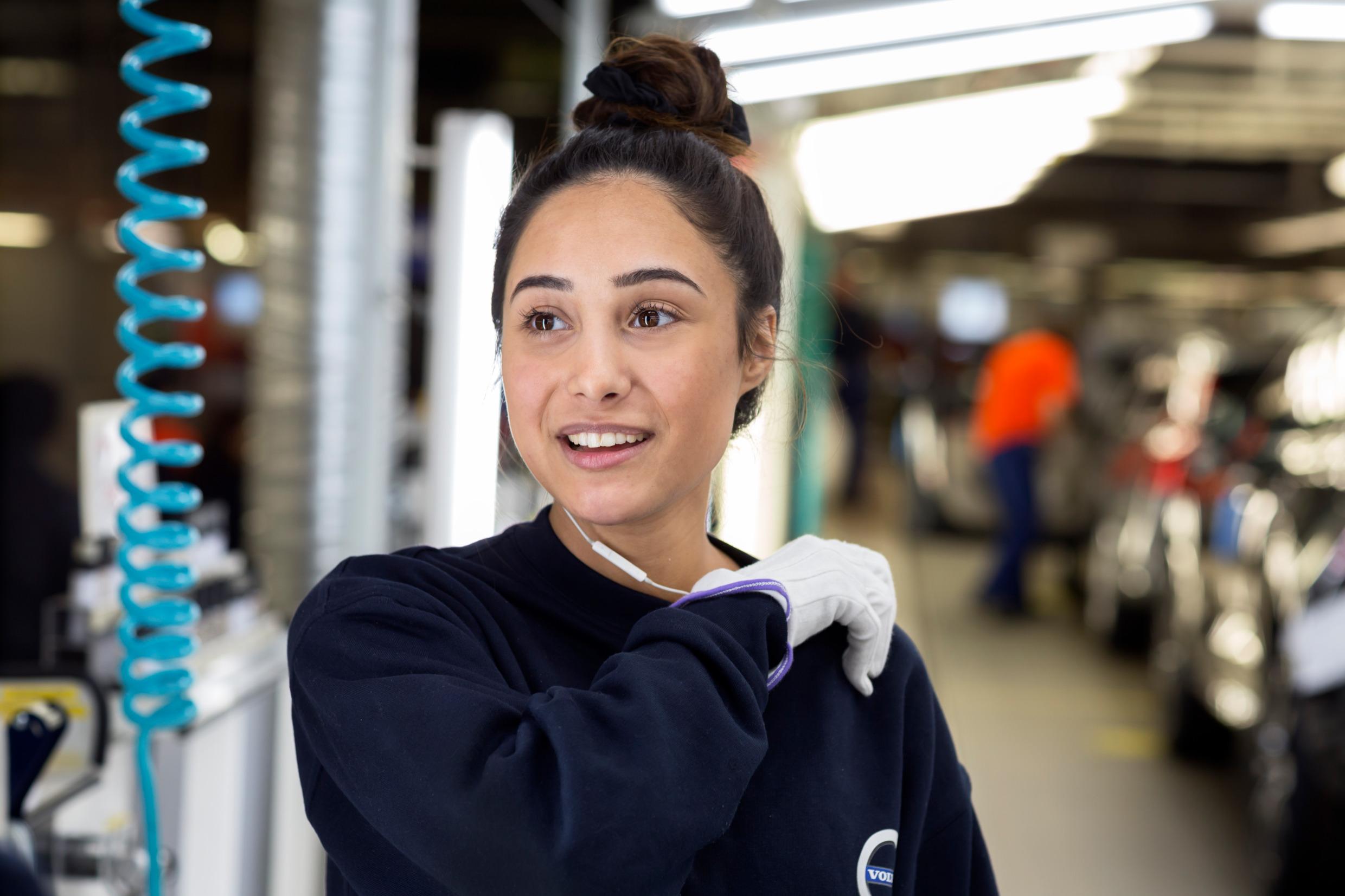 A woman working in an industry setting.