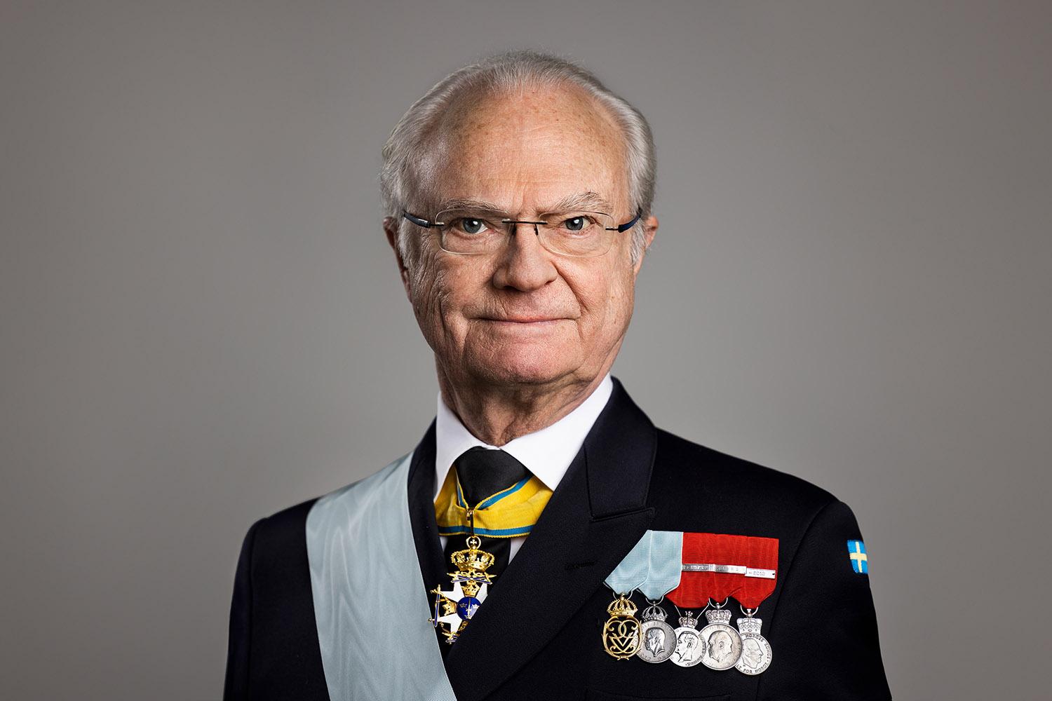 HM the King in a suit, wearing his medals.