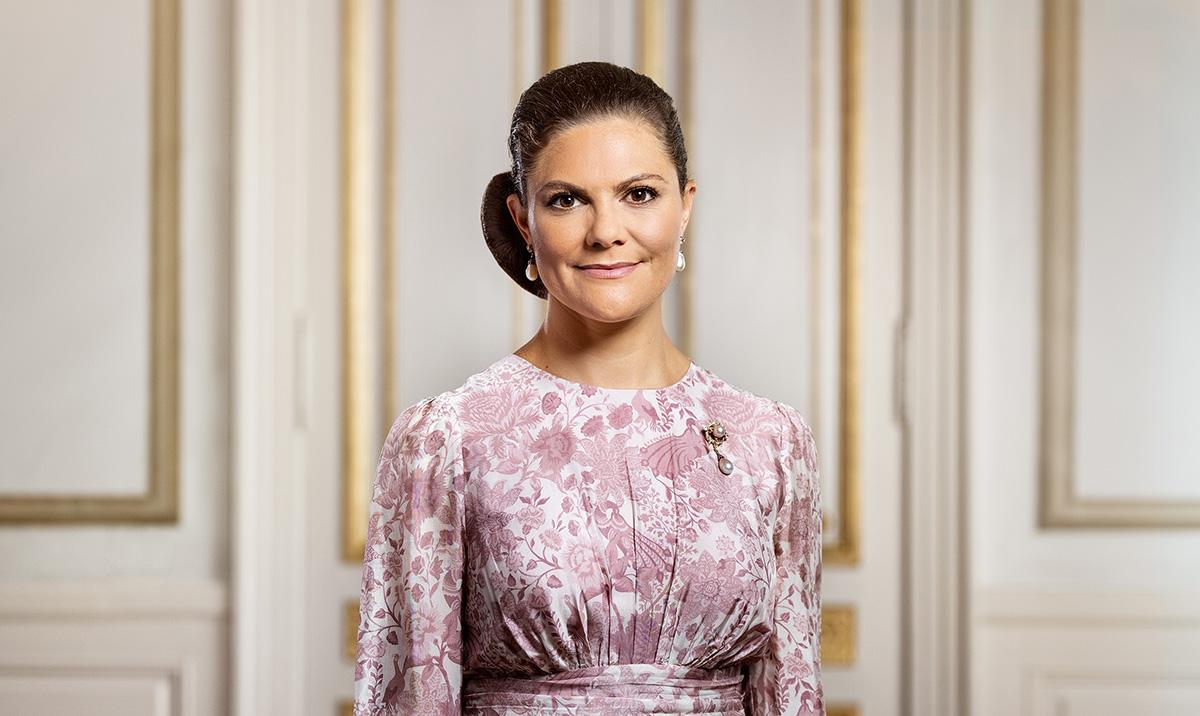 The crown princess smiling, in a room at the Royal castle.