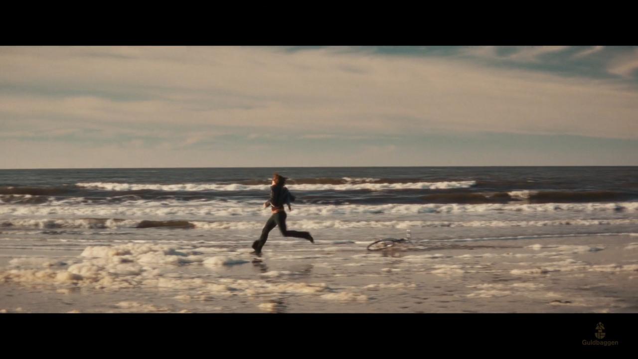 A person running on a beach