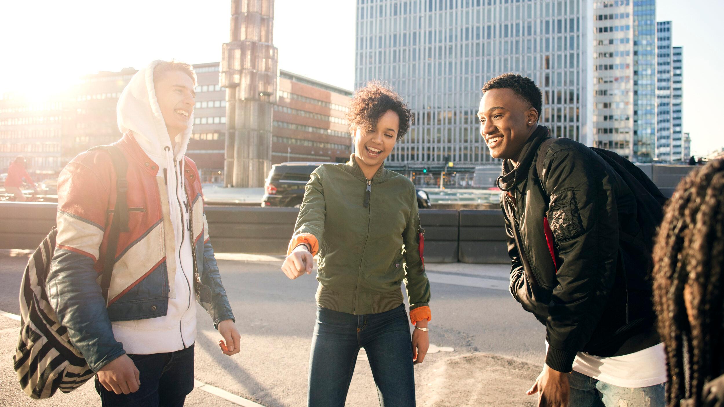 Three young adults hanging out in central Stockholm.