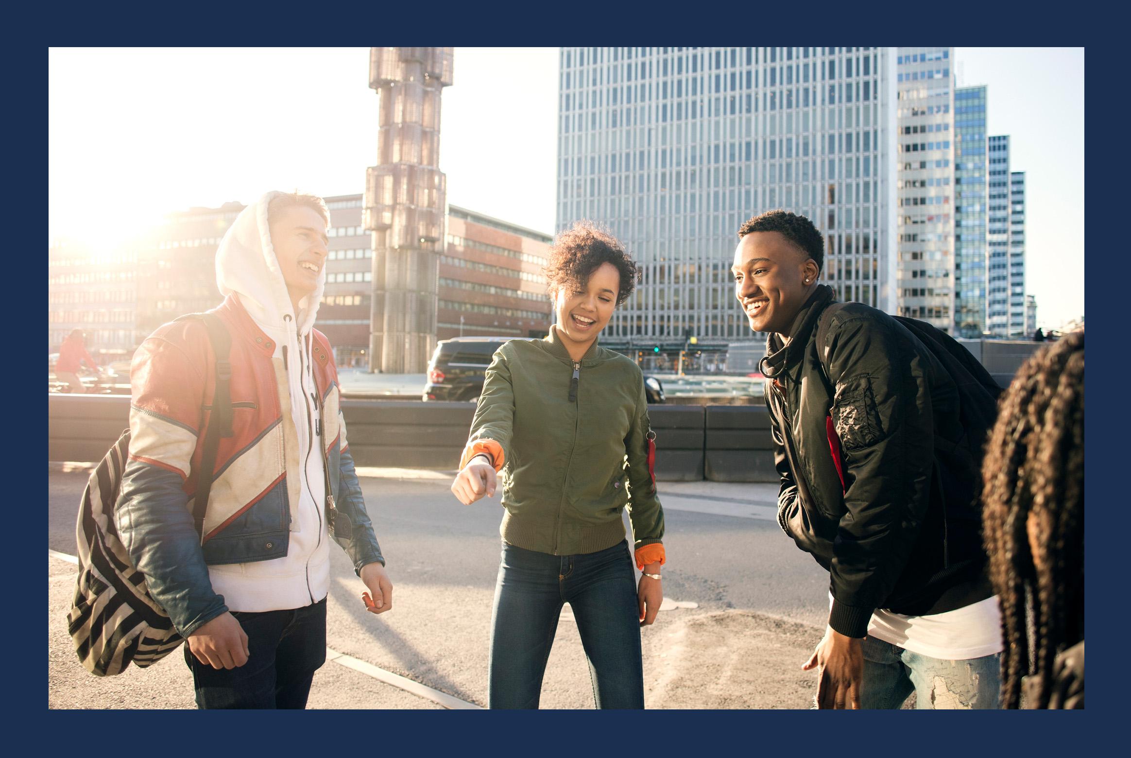Three young adults hanging out in central Stockholm.