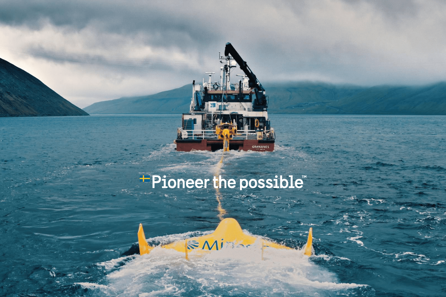 A boat at sea with a yellow device attached to it.