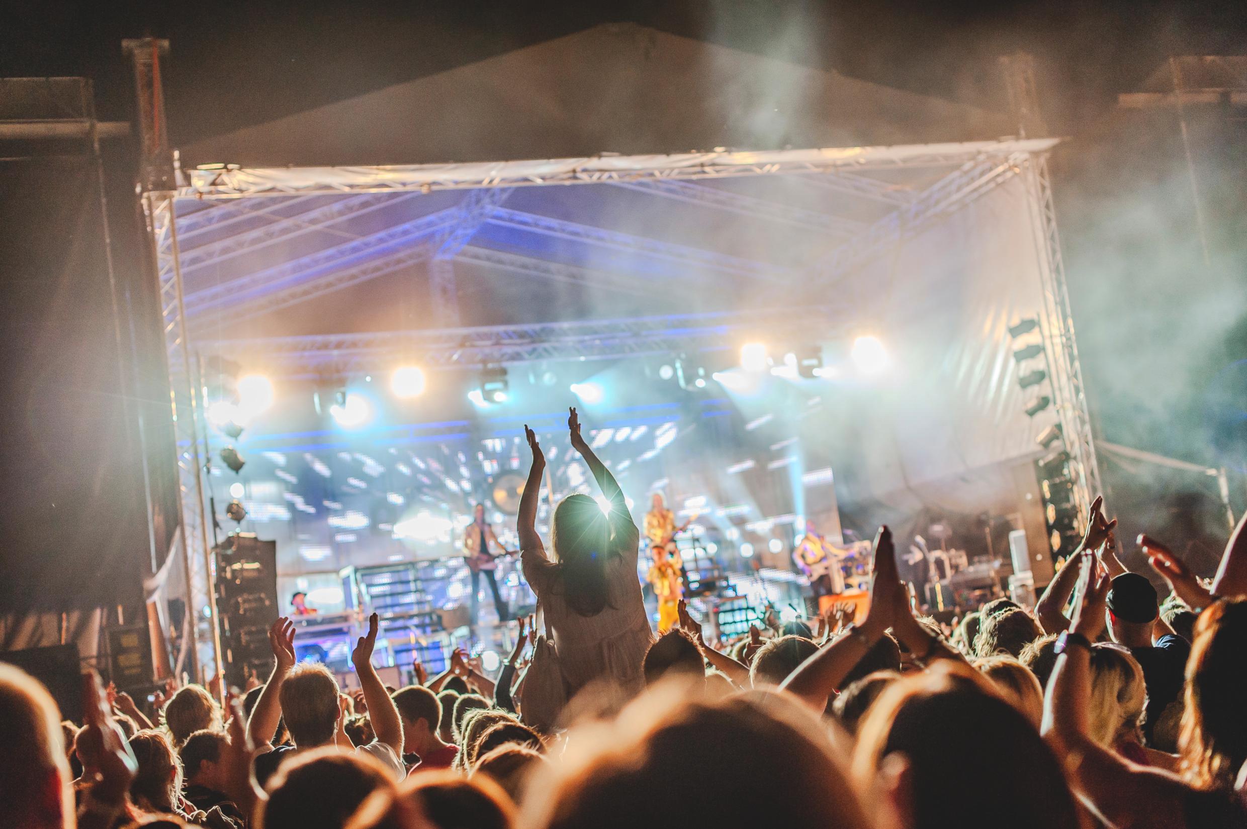 A live music stage with a large audience.