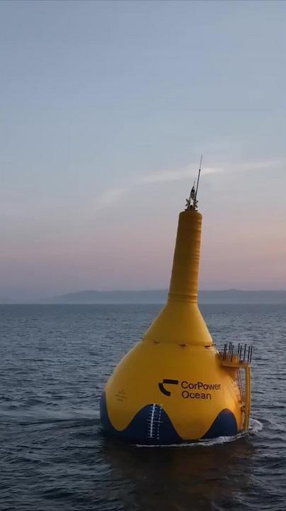 A yellow floating device in the ocean.