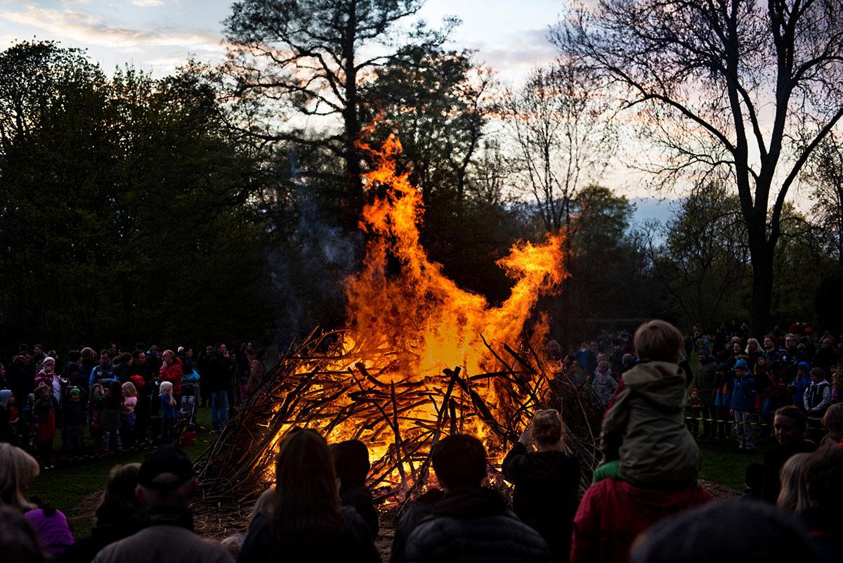 People watching a bonfire.
